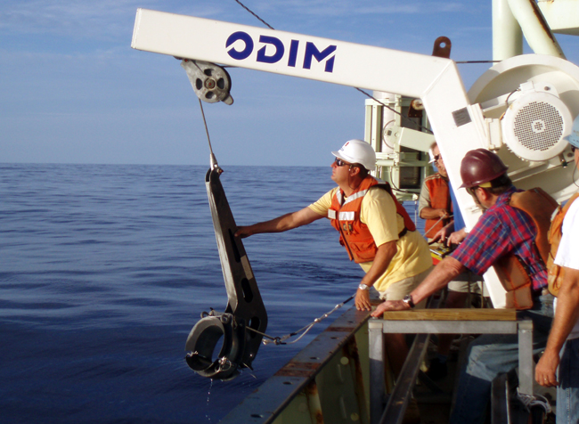The clamps are lowered and ?drop off? the end of the core barrel, and are then hauled back up to the davits for recovery.