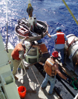  Latching the release module, powered by the Benthos Smart Release, into place.