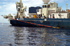  The Davits are engaged and the core barrel is hoisted to horizontal pivoting at the Grapple.
