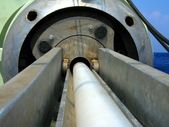 After the core is secured, extrusion begins by loading plastic pushrods into the extruder breach.