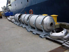 Heads in their cradles alongside R/V <em>Knorr</em>.  Insert weights can be seen to the left of the coreheads.