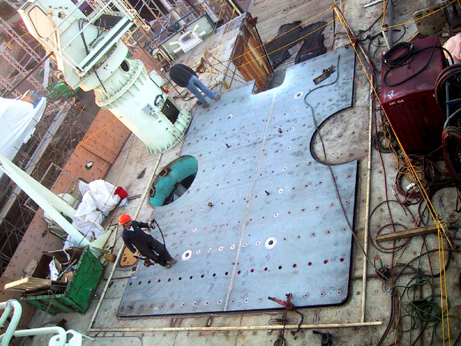 The ?Superdeck Module? being fit.  The four large holes in a rectangular pattern [middle of the photo] are reinforced deck sockets where specially designed pins will be installed to secure the main ODIM winch.