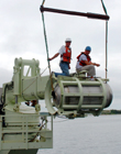 Corehead being loaded into its handling grapple at WHOI?s Iselin Marine facility.
