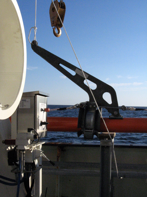 Before launch, clamps that work in tandem with the starboard tipping davits are attached.