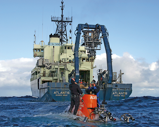 Trained divers (members of Alvin's team) assist with the sub's launch and recovery