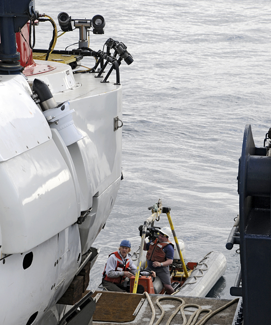 Matthew Barton, up close and personally video taping Alvin deployment.