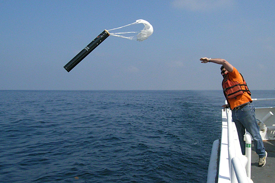 Dave Morton throwing overboard a sonobuoy hydrophone receiver.