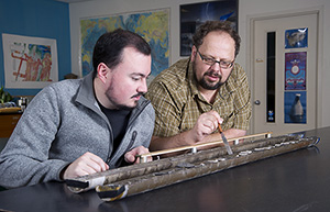 Camilo Ponton and Liviu Giosan with sediment core