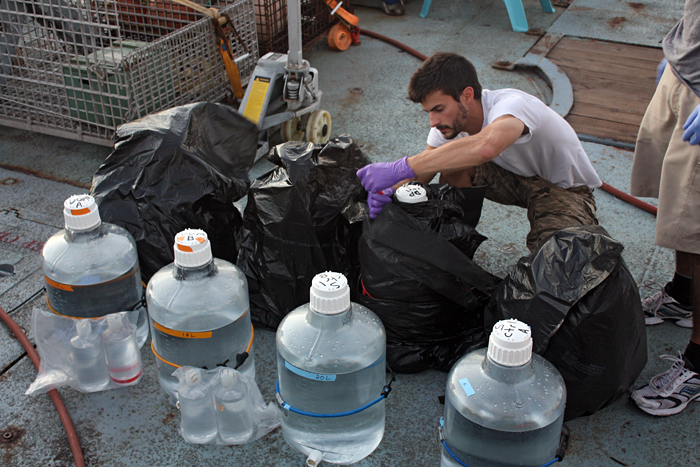 Jamie Becker preparing incubation bottles at sea in 2010