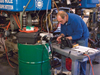 Research Engineer Bob Elder tests refurbished pigtail wiring before reinstalling electrical components during a rebuild of the remotely operated vehicle Jason.