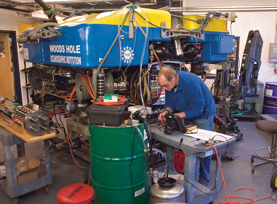 Research Engineer Bob Elder tests refurbished pigtail wiring before reinstalling electrical components during a rebuild of the remotely operated vehicle Jason.