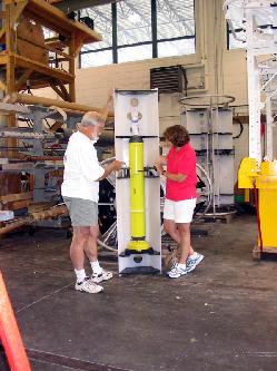 Image of Jim Valdes, WHOI engineer and Amy Bower examining new profiling float