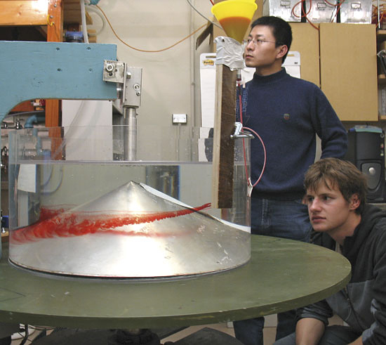 Graduate students Jinbo Wang (left) and Evgeny Logvinov.