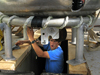 Terry Hammar working underneath the 'dog dish' component of the Long Core system.