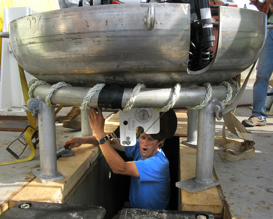 Terry Hammar working underneath the 'dog dish' component of the Long Core system.