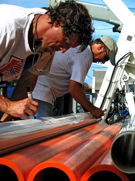 Terry Hammar and Al Gagnon labeling cores recovered with the Long Core.