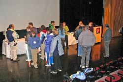 image of audience approaching exhibit table