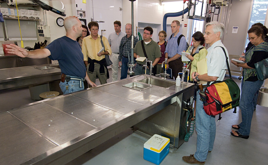 Scott Cramer showing the Ocean Science Journalism Fellows the MRF facility.