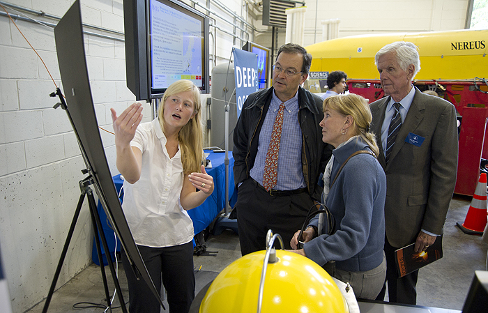 Joint Program student Emily Roland describes her work to Trustees Steven Hoch, Georgette McConnell and Tom Wheeler.