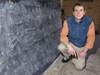 Gene Terray with uncovered blackboard.