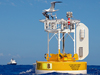 The WHOTS III buoy off Hawaii with the R/V Revelle in background.