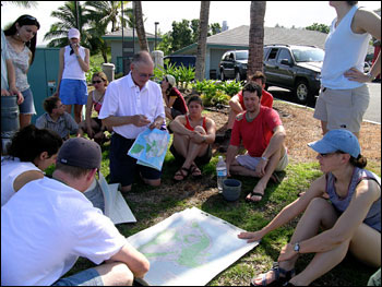 The group consults maps before setting out for the Kaupulehu flow.