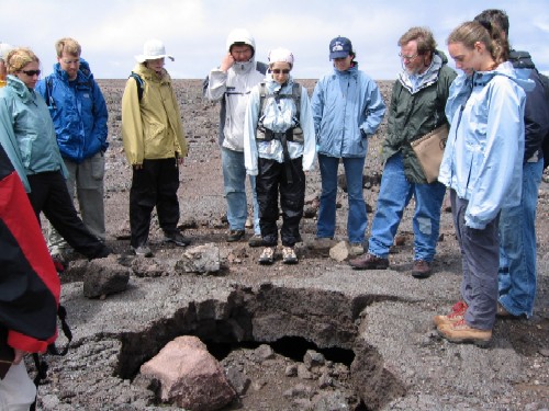 The group was led on a tour of explosive eruption deposits from Kilauea Volcano by Don Swanson, scientist-in-charge at the Hawaiian Volcanoes Observatory. Here, Don shows us a boulder ejected during the 1880 (?) eruption that has us transfixed.