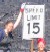 Margaret Boettcher and Jessica Williams assist the Kilauea Police Department in enforcing strict speed limits on lava flows.  In actuality, this sign once marked the speed limit on a coastal highway that was covered by lava during the current Pu?u ?O?o-Kupaianaha eruption.