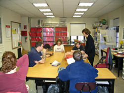 Dr. Bower talks to students in the classroom at the Perkins School.