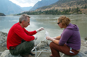 collecting water samples from the Fraser River