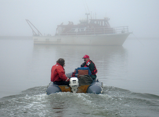 On a gray day in August 2006, WHOI research associate Phil Alatalo (right) and Captain Bill Kopplin motored out to the R/V Annika Marie at Barrow, Alaska.