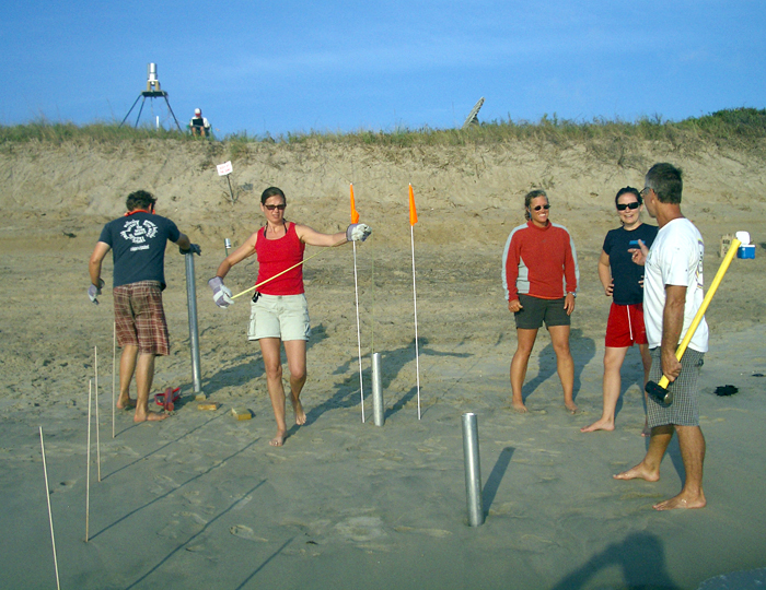 Becky Gast and colleagues setting up sample cores on beach at Duck, N.C.