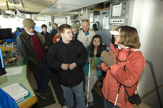 Amy Bower showing Perkins School students around the Pilot House of Knorr.
