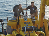 WHOI scientist Richard Camilli shakes hands with pilot Konstantinos 