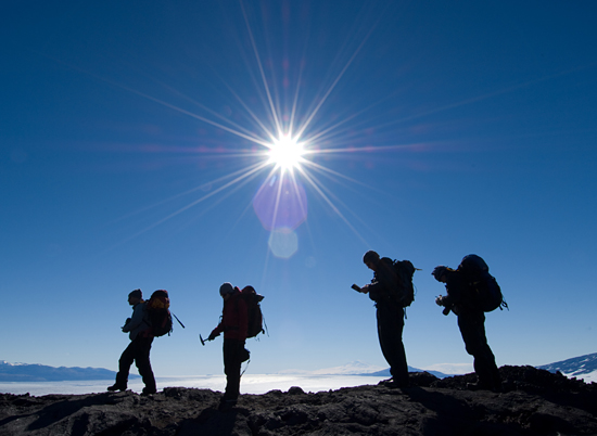 The field team moves out along a ridge above the Koettlitz Glacier.