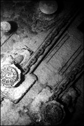  A close-up view of the ship's anchor chains, winches and capstans.