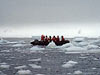 researchers thread their way through pack ice