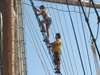 JP students climbing ships rigging.