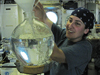 WHOI Postdoc Mar Nieto Cid filtering seawater in R/V Oceanus wet lab.