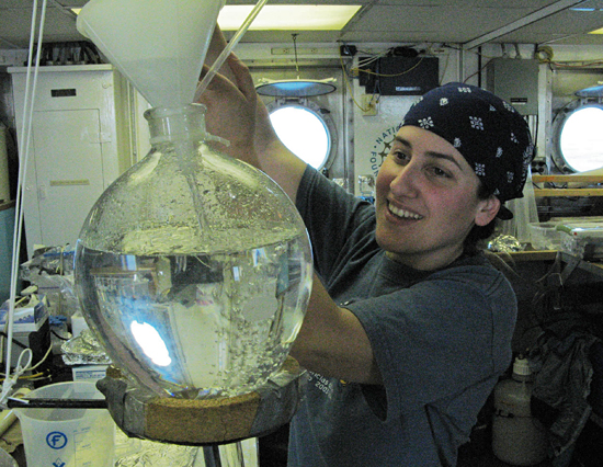 WHOI Postdoc Mar Nieto Cid filtering seawater in R/V Oceanus wet lab.
