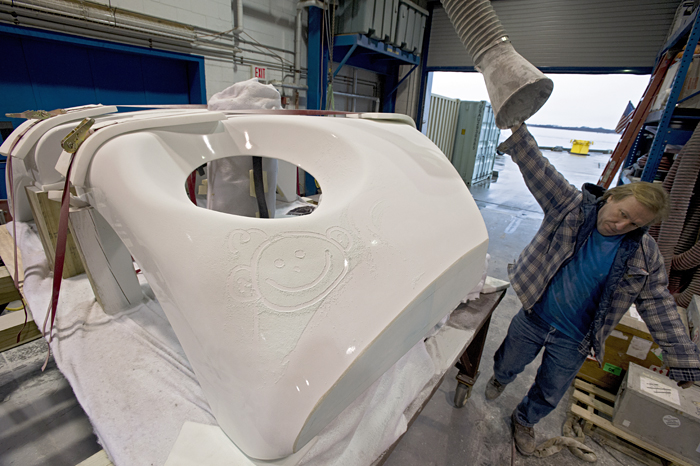 Vic Miller brings a duct to suck up foam dust