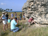 Geodynamcs field trippers with huge chunk of fossil coral in Bahamas