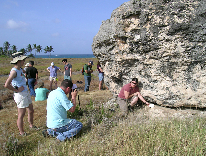 Geodynamcs field trippers with huge chunk of fossil coral in Bahamas