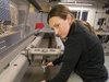 PO Engineering Assistant Dara Tebo testing cable strength in the rigging shop.