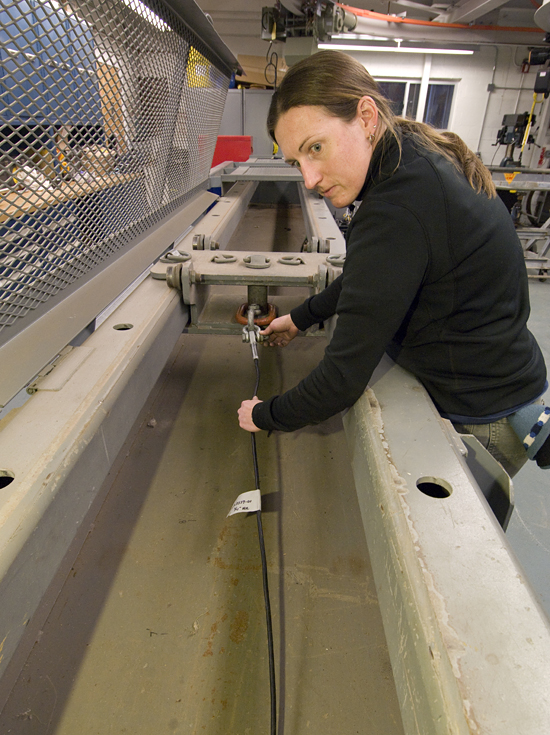 PO Engineering Assistant Dara Tebo testing cable strength in the rigging shop.