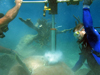 Divers drill a coral core