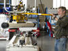 Researcher moves 1.5 meter long core to bench where it will be split.