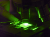 microscope slide under a fluorescence microscope