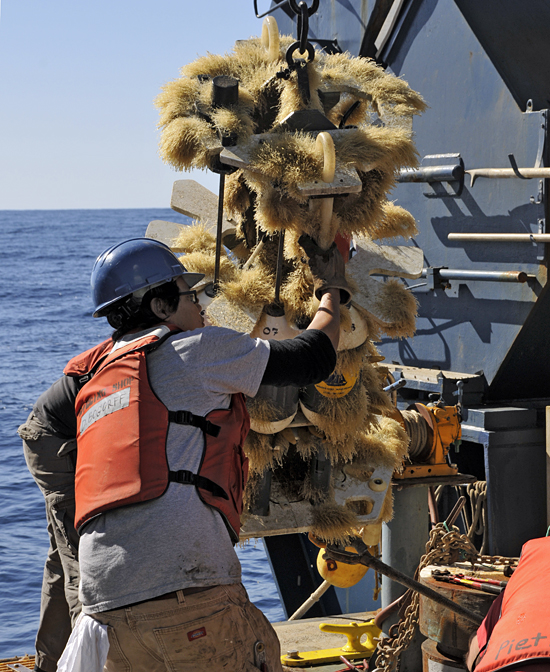 Daniel Bogorff cleaning biofouling off an instrument