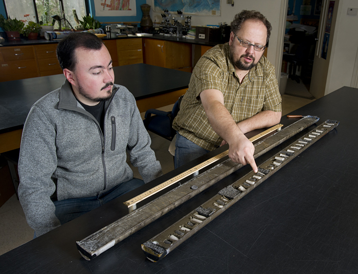 Camilo Ponton and Liviu Giosan examine a sediment core from India
